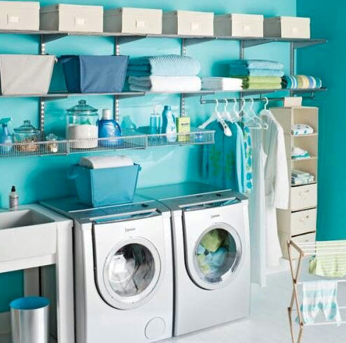 blue and white organized laundry room